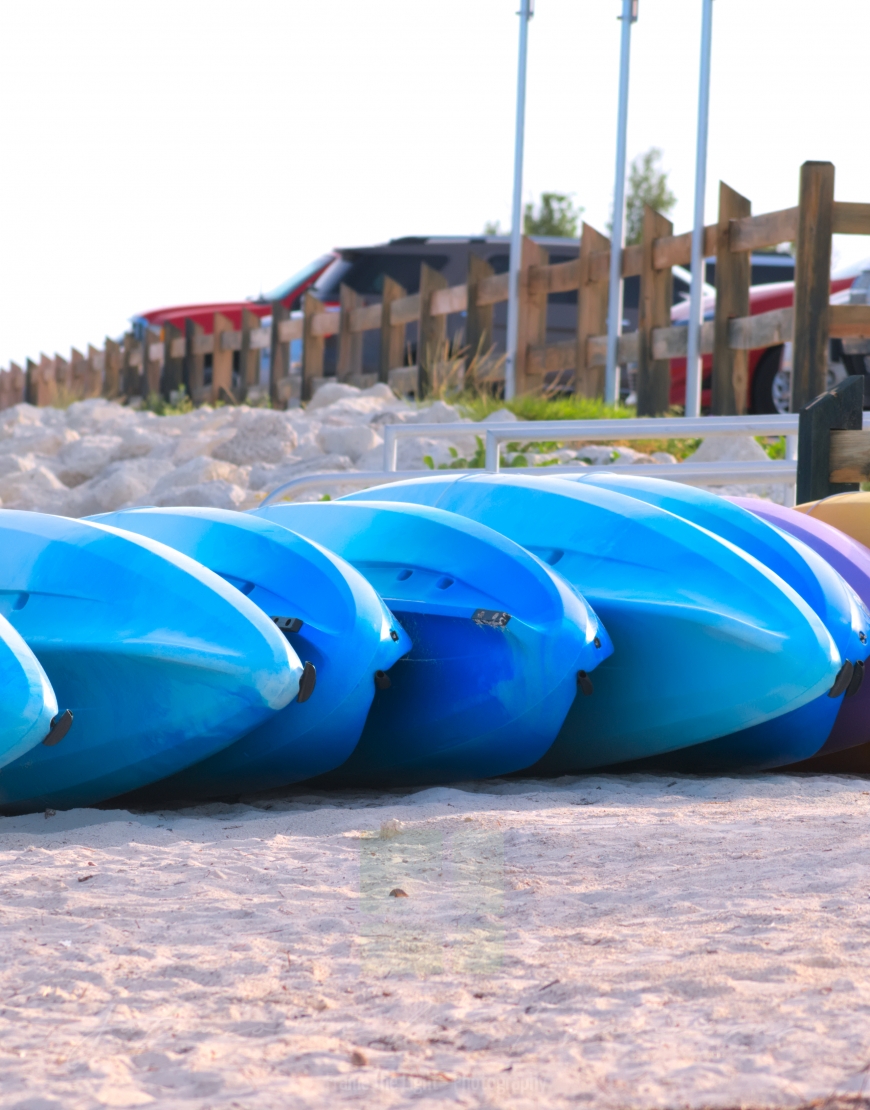 Kayaks waiting on the sand