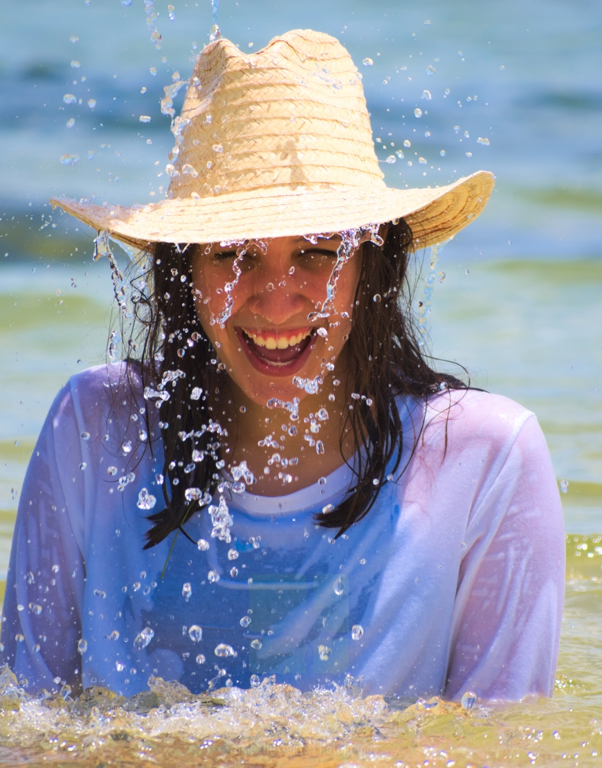 Laughing under a waterfall