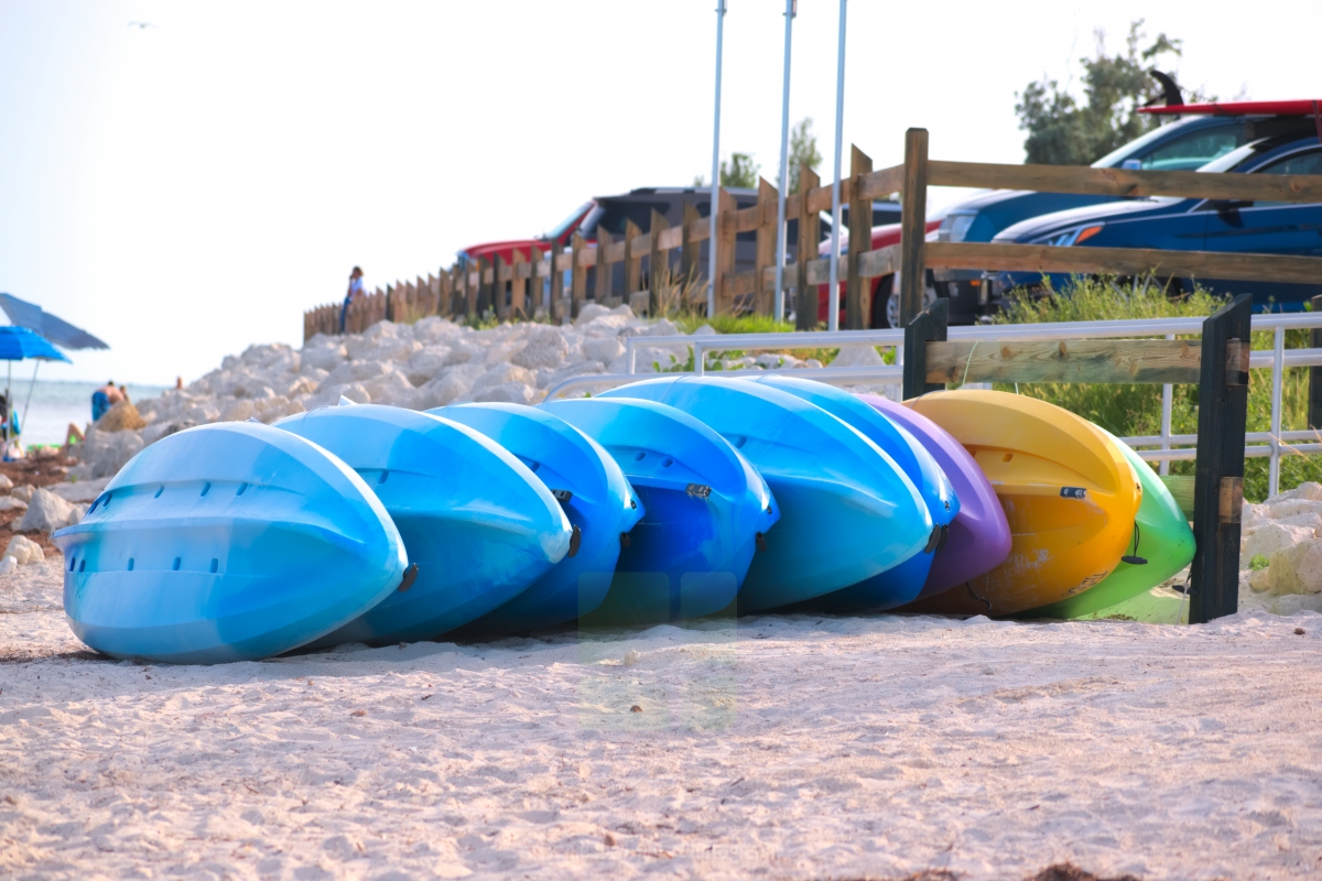 Kayaks waiting on the sand