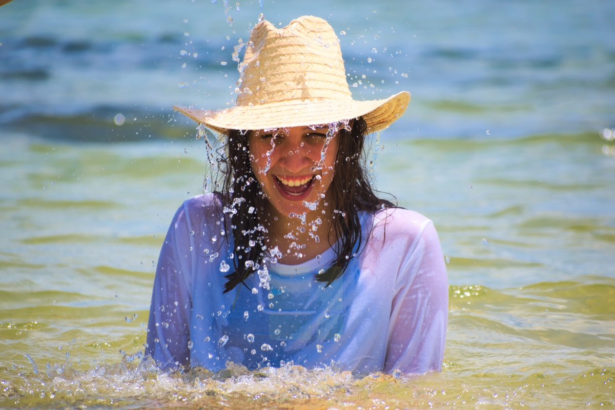 Laughing under a waterfall